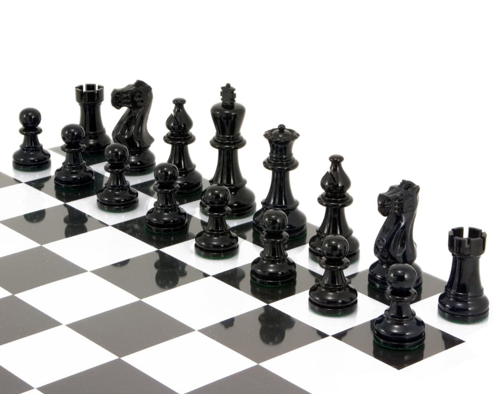 Atlantic Series Staunton chess pieces in black lacquer, polished, weighted and felted, displayed on a chessboard.