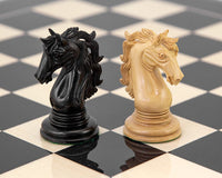 Ebony and ivory knight chess pieces from the Constantine Luxury Chess set on a black and white chessboard