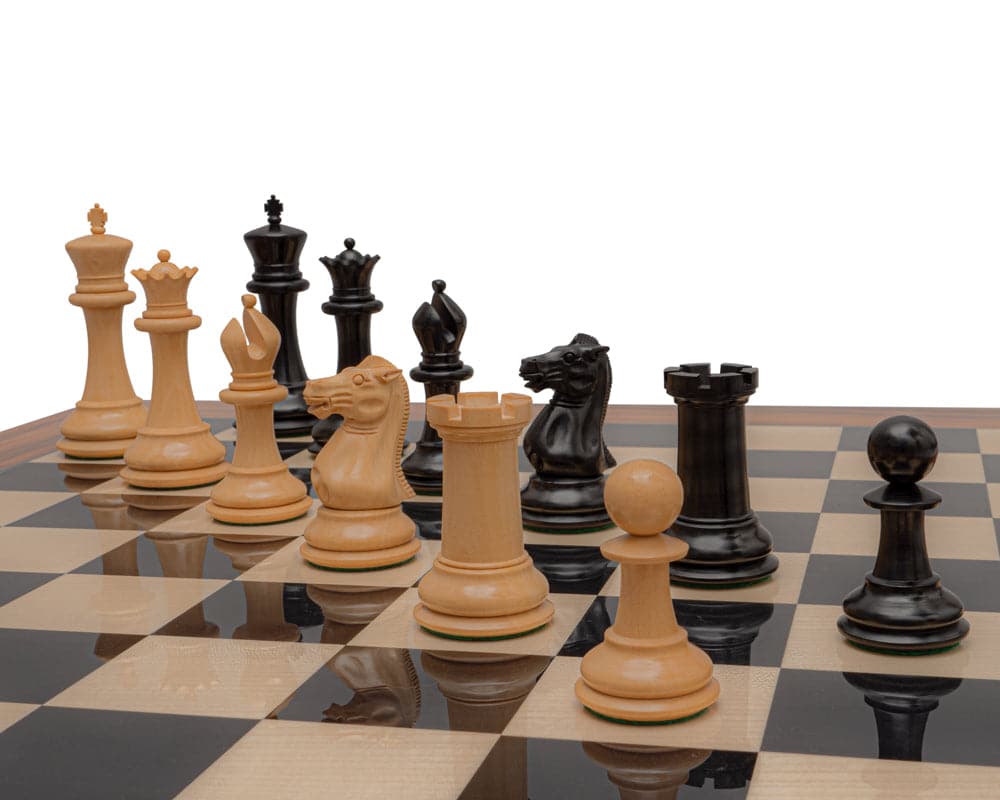 Reproduction Staunton Ebony Chessmen 1849 Model with 4.4 inch King on chessboard, featuring handcrafted ebony and boxwood pieces.