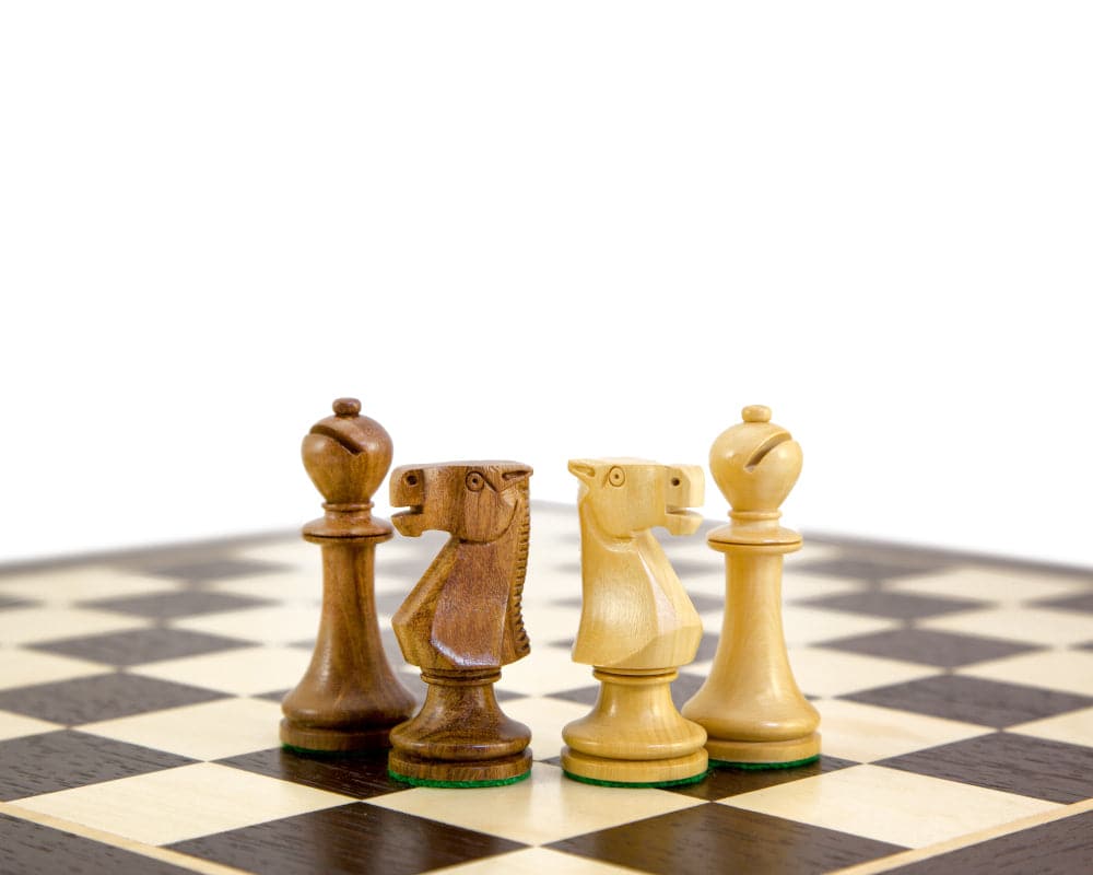 Kingsclere EO Staunton 2.5-inch weighted and felted boxwood chess pieces on chessboard