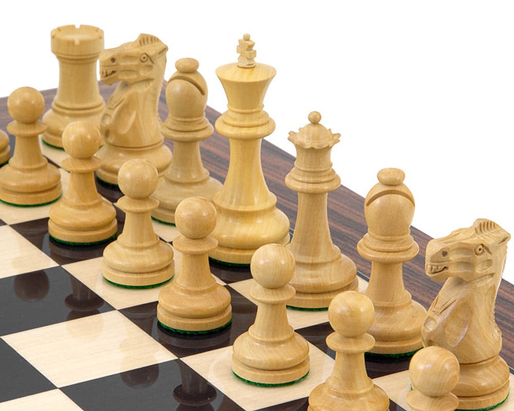 Classic Staunton solid ebony and boxwood chess pieces on a luxurious chess board with perfect balance and billiard cloth bases.