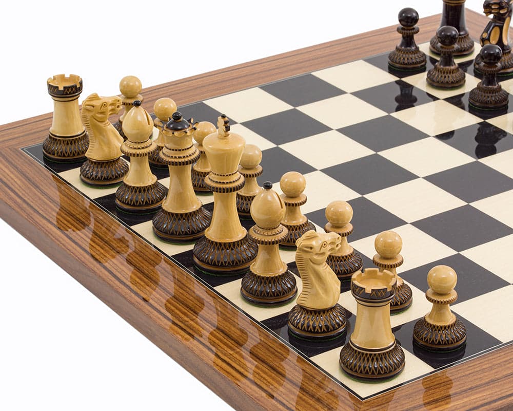 The Burnt Parker Palisander Chess Set with intricately carved boxwood pieces on a high gloss Black Anegre and Palisander Deluxe Chess Board.