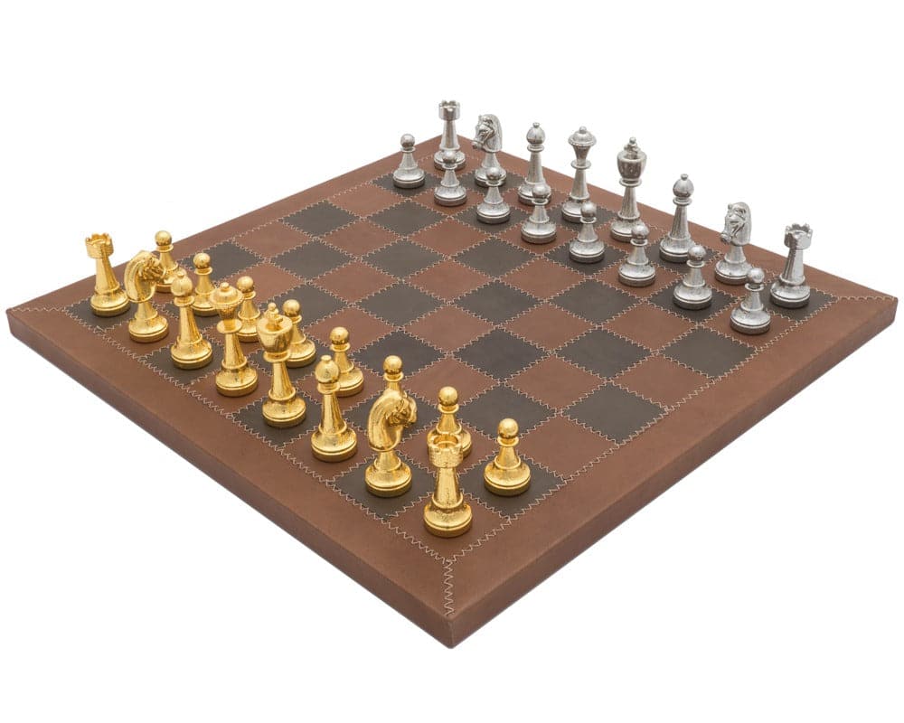 The Messina Gold and Silver Italian Leather Luxury Chess Set with gold and silver pieces on a brown and black checkered board.