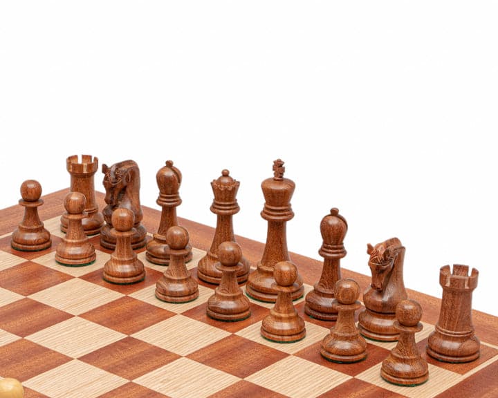 The Leningrad Acacia and Mahogany Chess Set in classic Staunton design on chessboard, featuring a 4 inch king and 2 additional queens.
