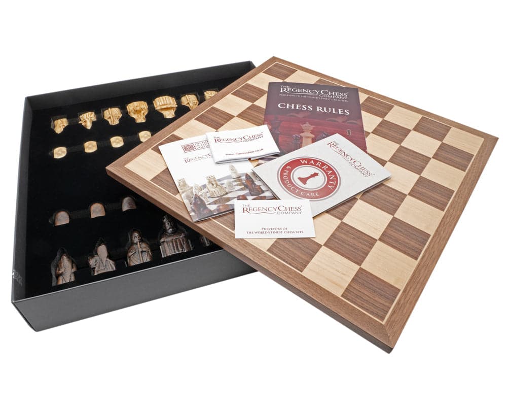 Isle of Lewis Chessmen and Board Presentation Set with chess pieces and rules booklet displayed in a black and wood box.